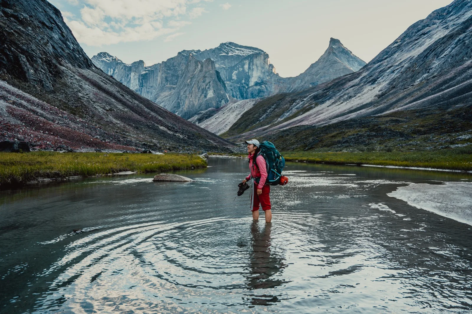 A mountain reflected in a still winding river