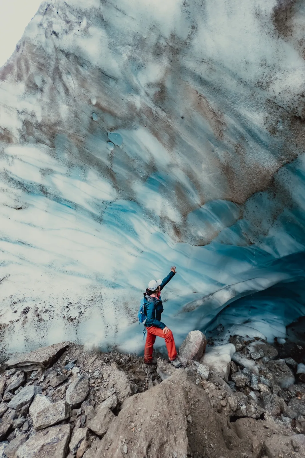 Blue glacial ice filling a high mountain basin