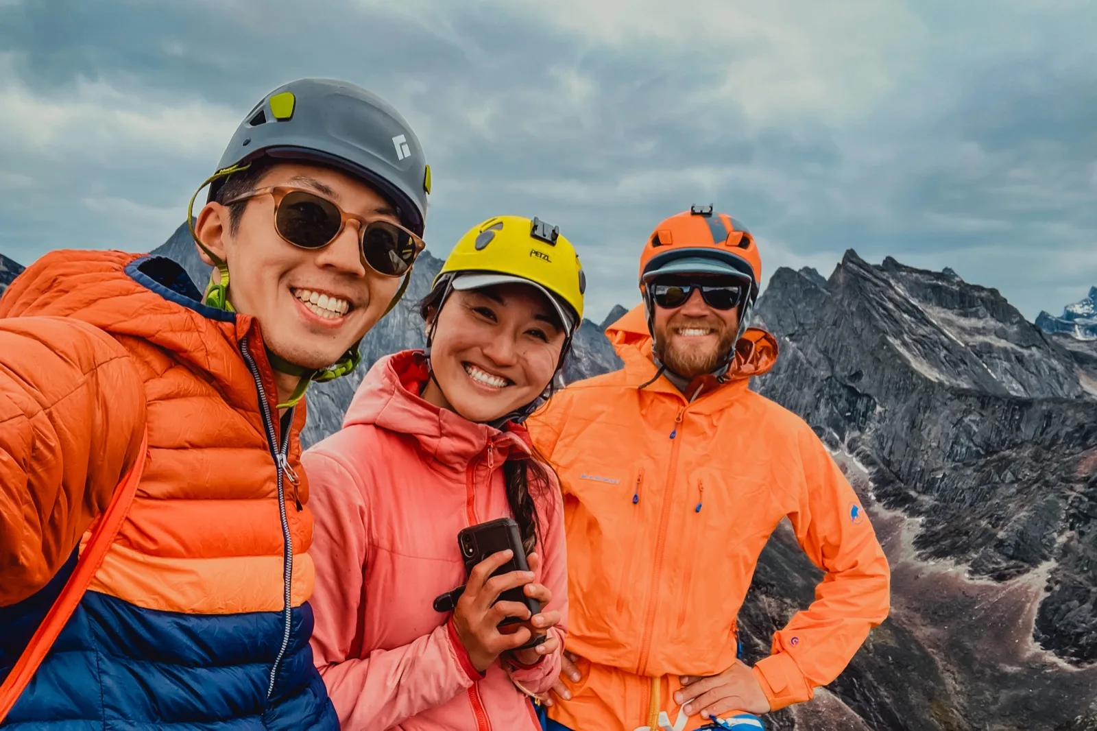 Backpackers gathered together in bright alpine light