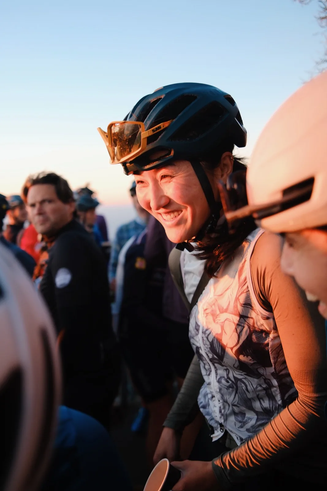 A smiling cyclist paused in the middle of a ride