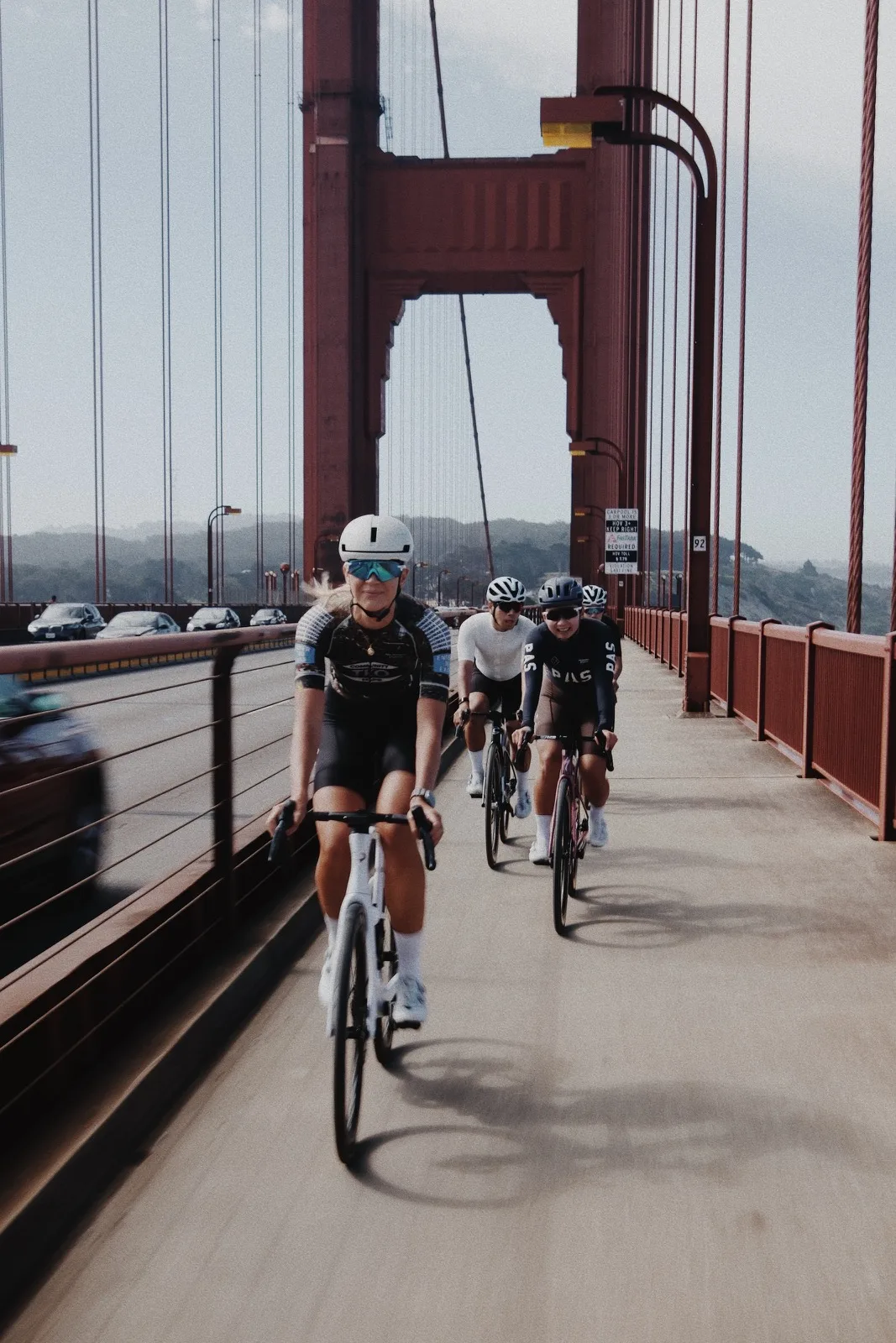 Cyclists riding toward the Golden Gate Bridge