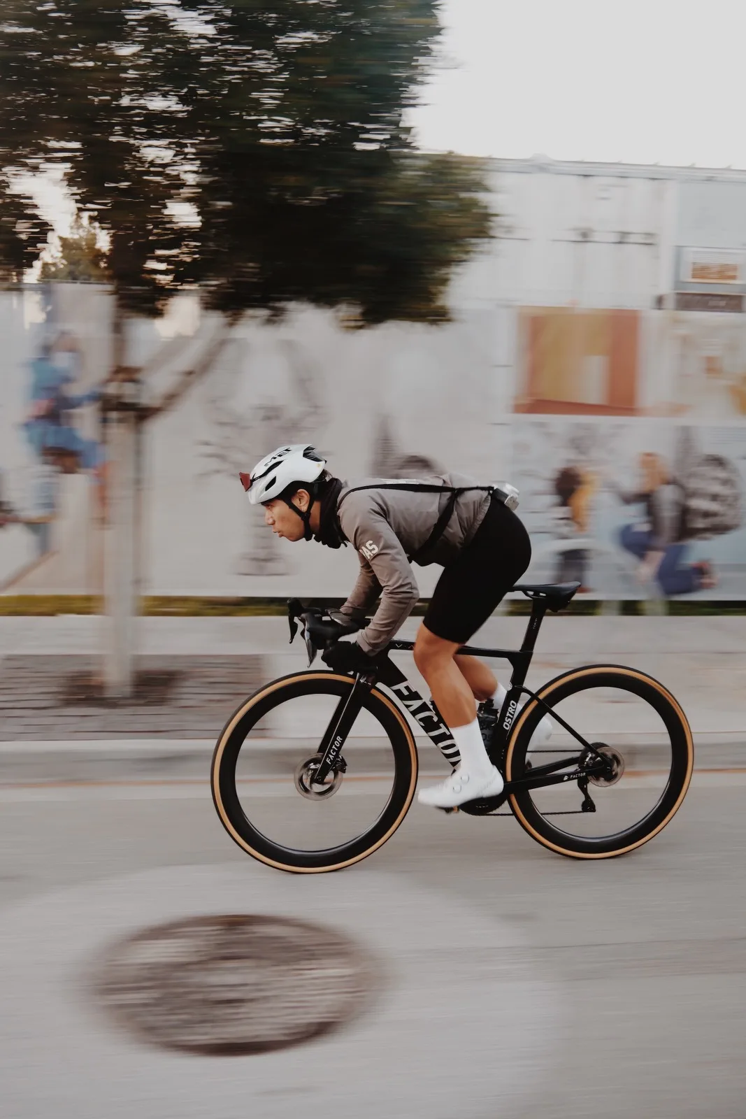 A cyclist held sharp against a streaked background