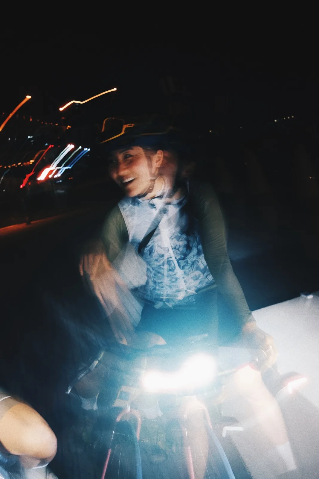 A cyclist portrait layered with blue and white motion blur