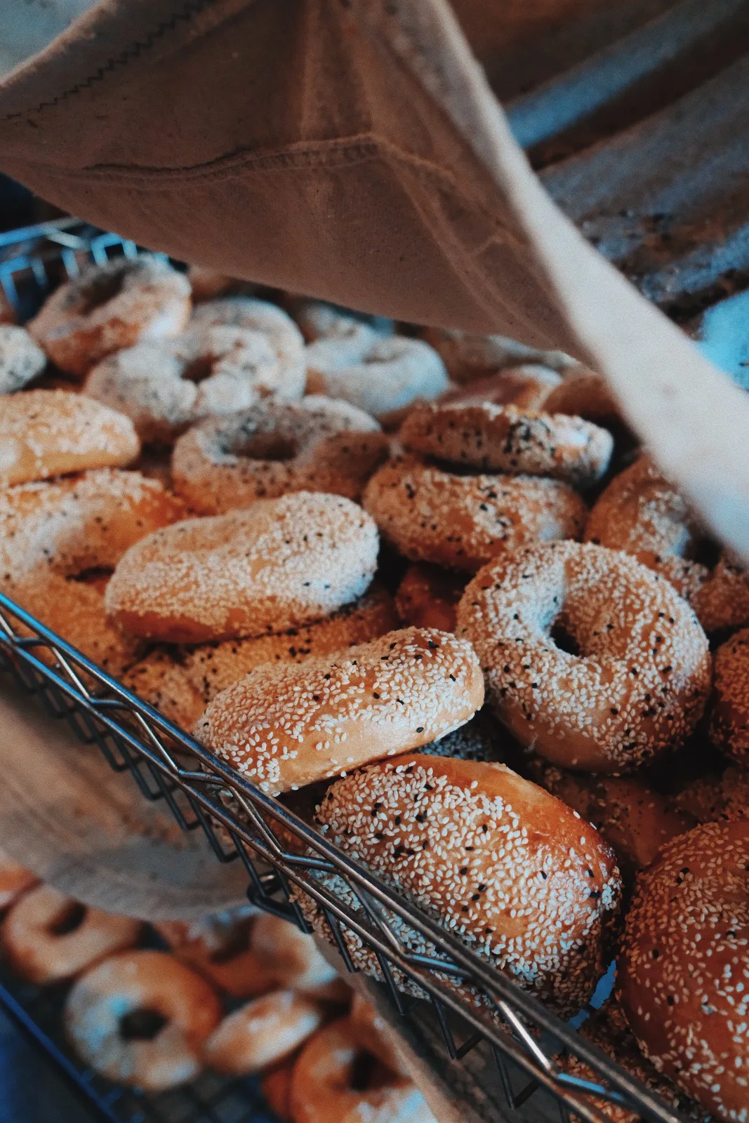 A tray piled with sesame bagels