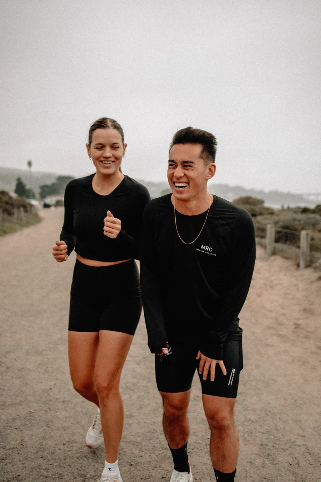 Two MRC runners laughing together