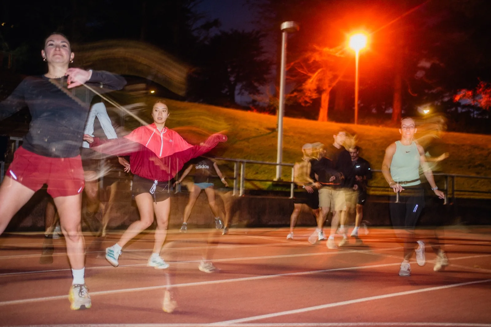 Layered motion blur of runners starting a track interval
