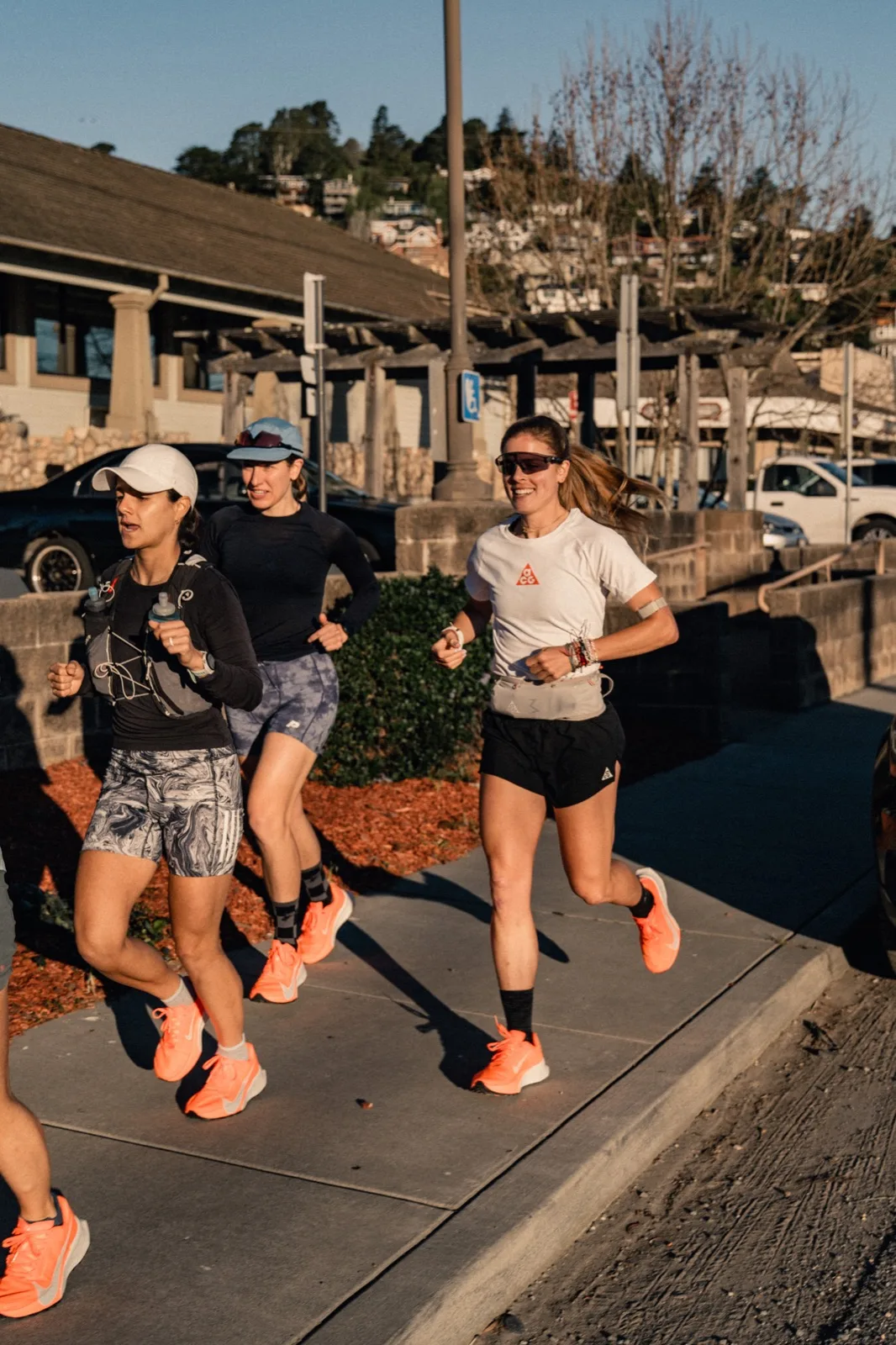 Trail runners setting out in warm morning light