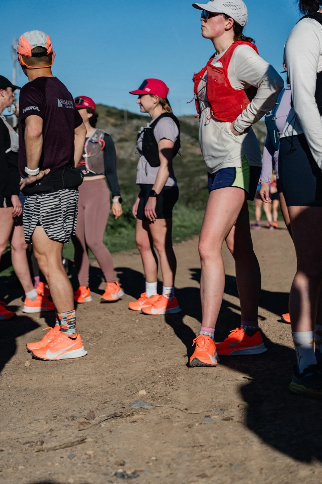 Close view of runners and bright shoes on the trail
