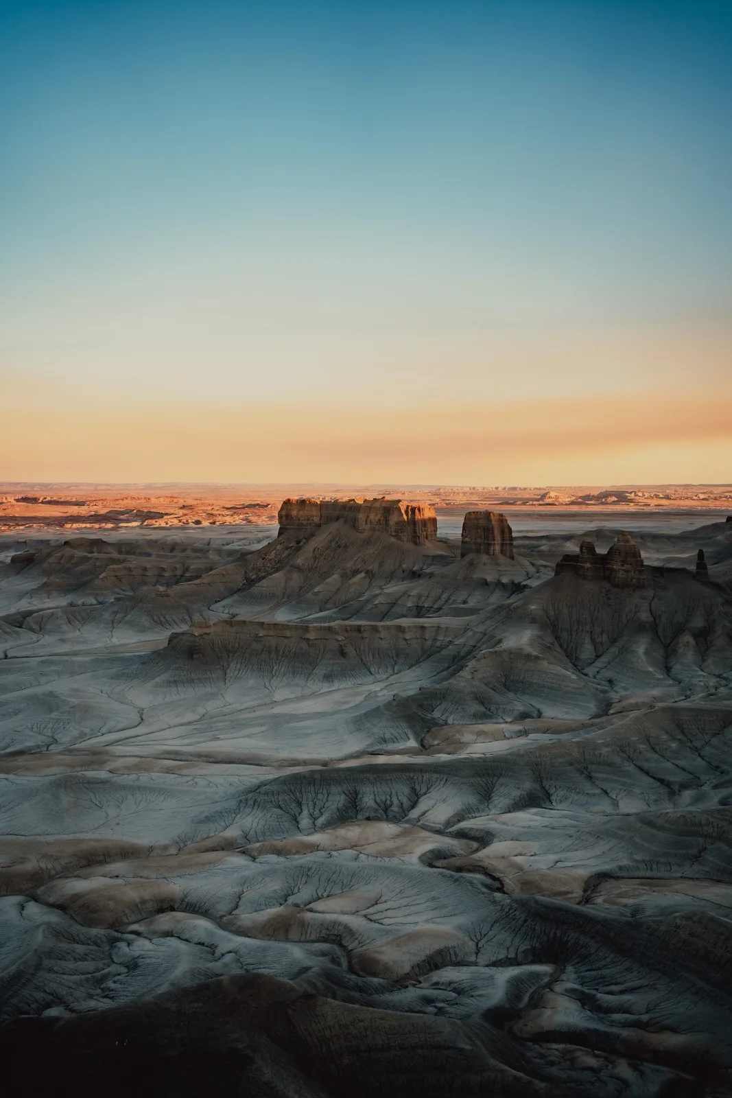 Desert badlands glowing after sunset